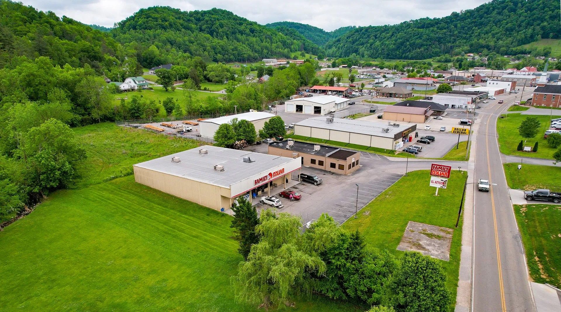Main Street in Sneedville, Tennessee, with surrounding Appalachian hills and small-town charm.