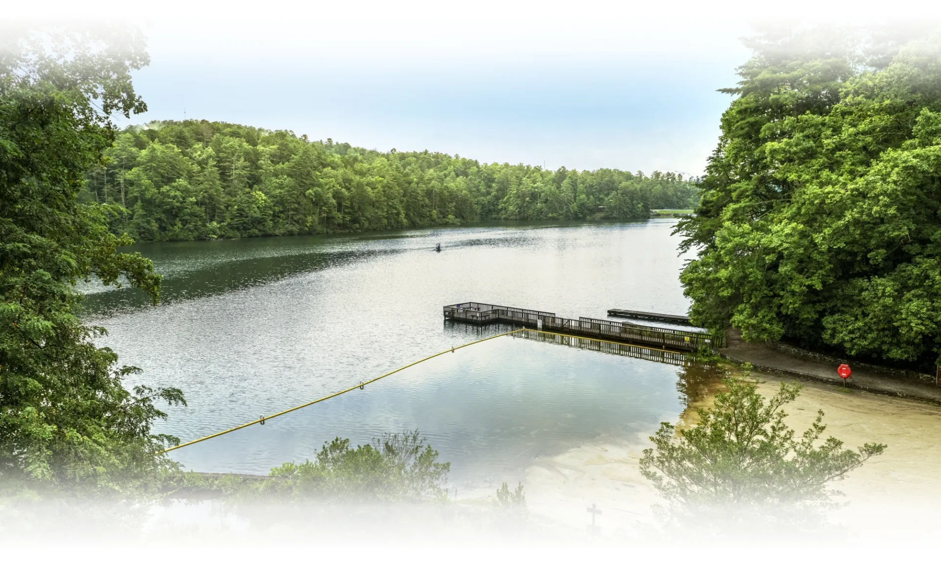 A calm stretch of the Nolichucky River with Appalachian Mountains in the background, near Unicoi, Tennessee.