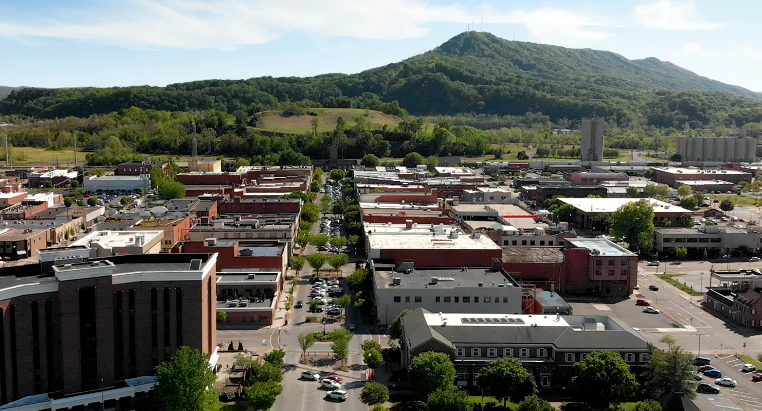 Downtown Kingsport, Tennessee, featuring a mix of historic and modern buildings with scenic mountain backdrops.